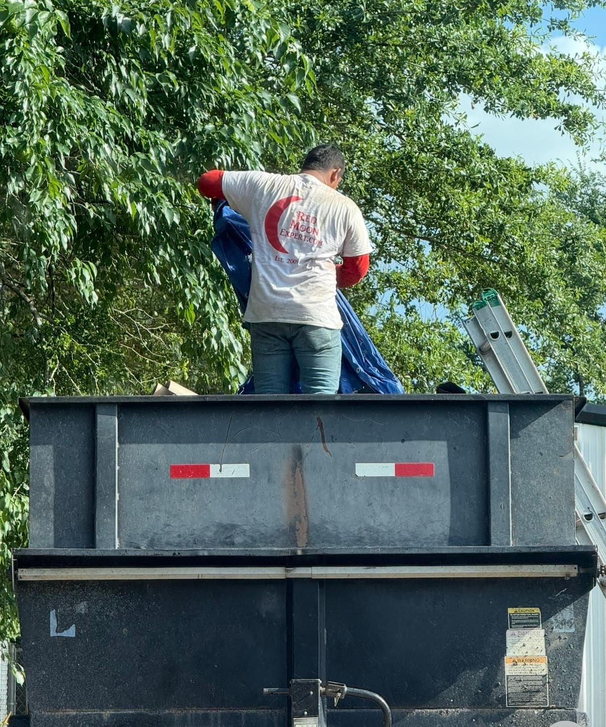 Red Moon Expert crew handling storm debris cleanup