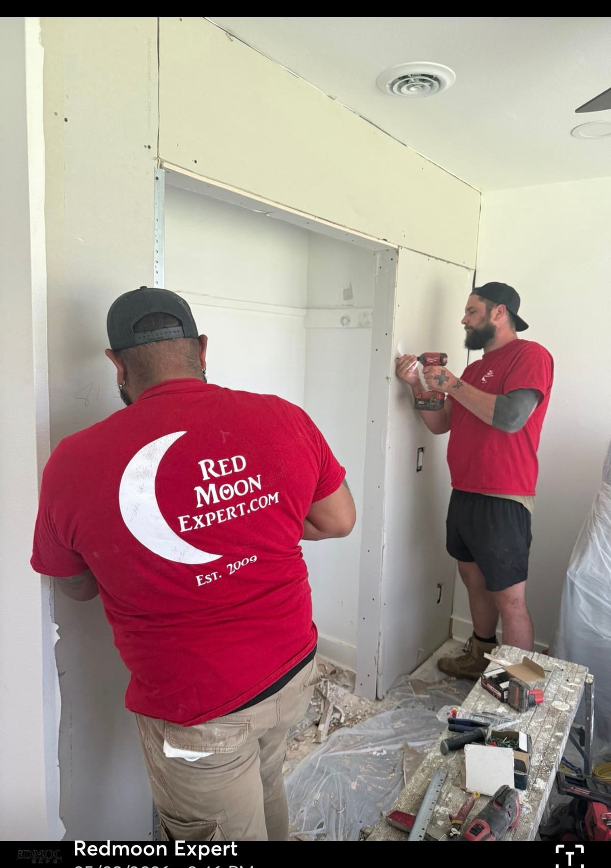 Red Moon Expert crew framing an interior wall